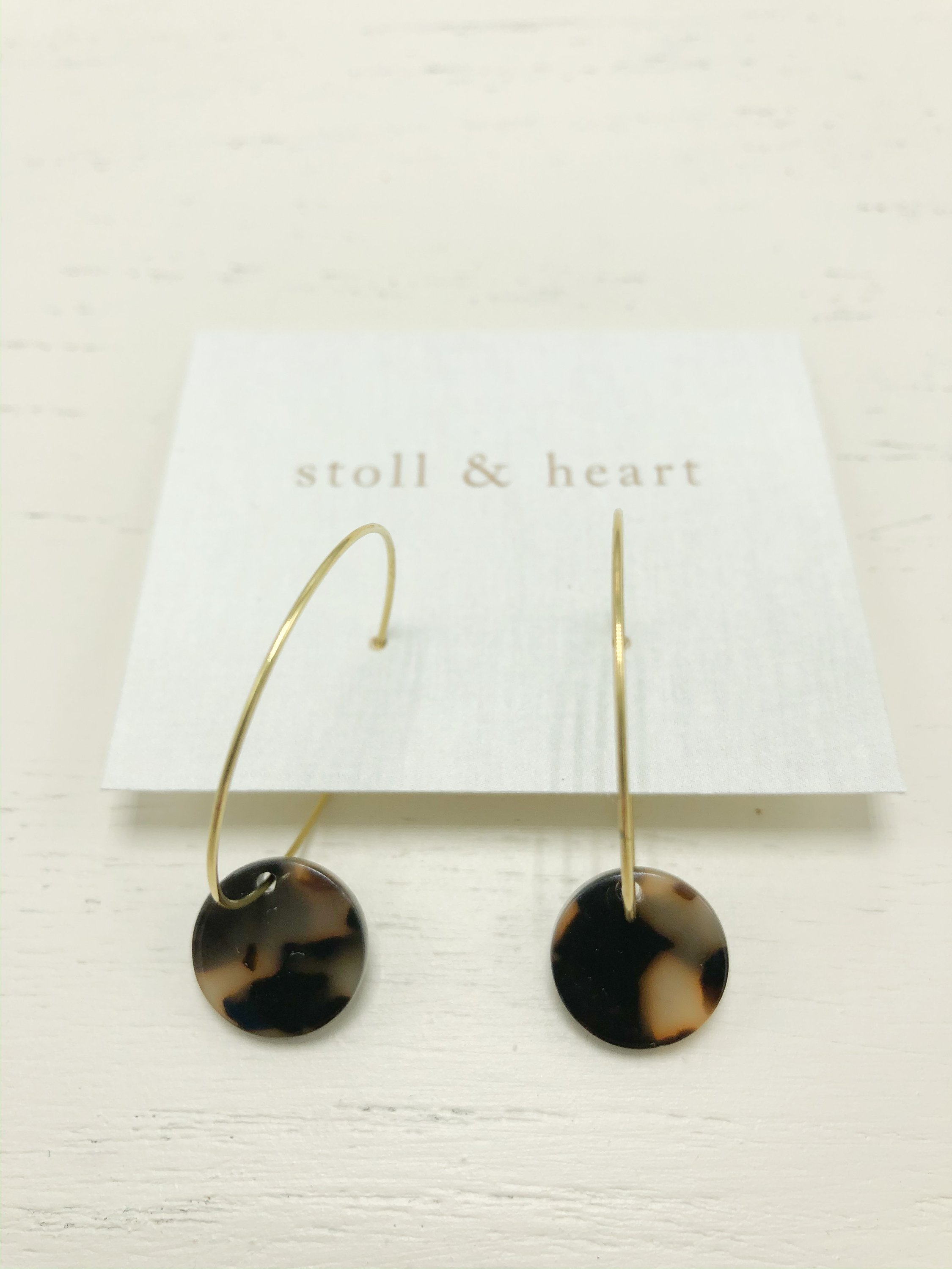 Stylish Marley Dark Tortoise Rounds earrings featuring brass hoops and dark tortoise shell resin detail.