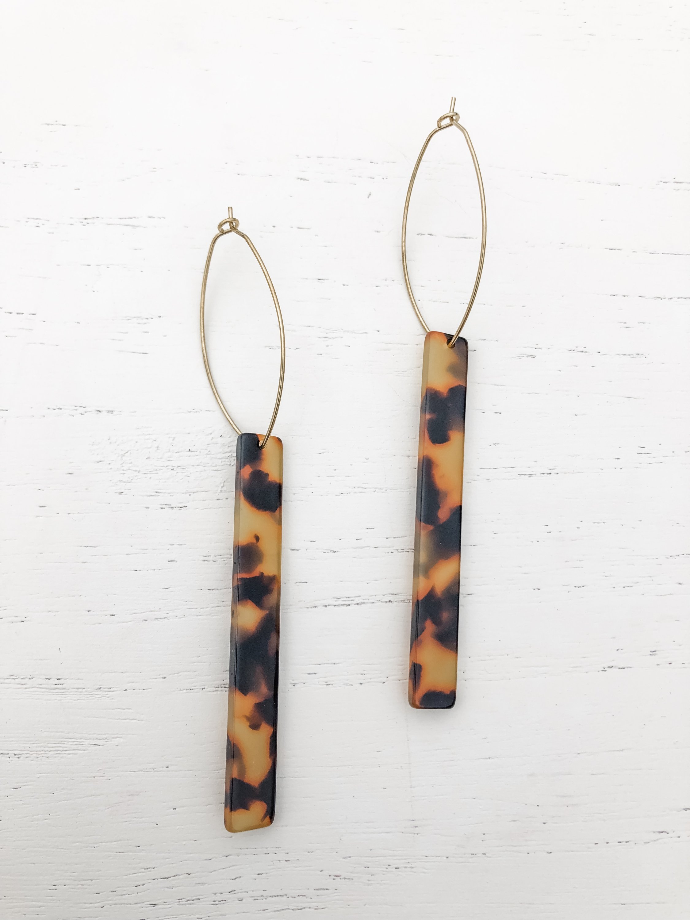 Melissa Tall Tortoise earrings featuring brass hoops and tortoise shell resin details, measuring approximately 3-5/8 inches in length.