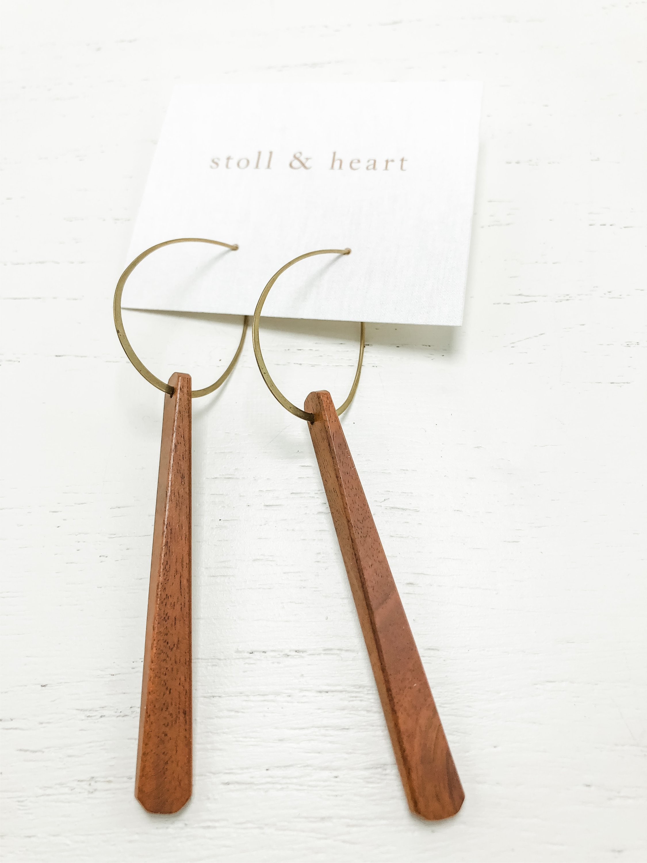 Midcentury Dark Wood earrings featuring brass hoops and natural wood accents, showcasing a modern and elegant design.