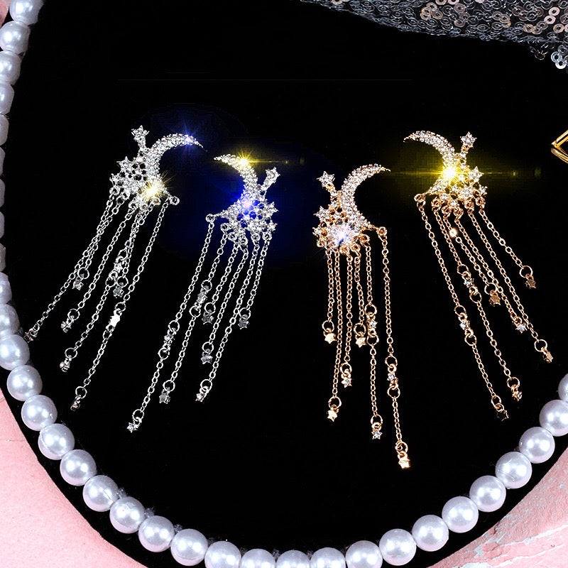 Elegant Moon and Star Tassel Earrings featuring rhinestones and alloy, showcasing a celestial design.