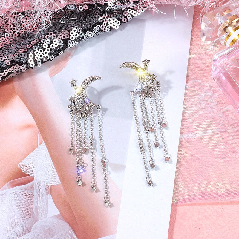 Elegant Moon and Star Tassel Earrings featuring rhinestones and alloy, showcasing a celestial design.