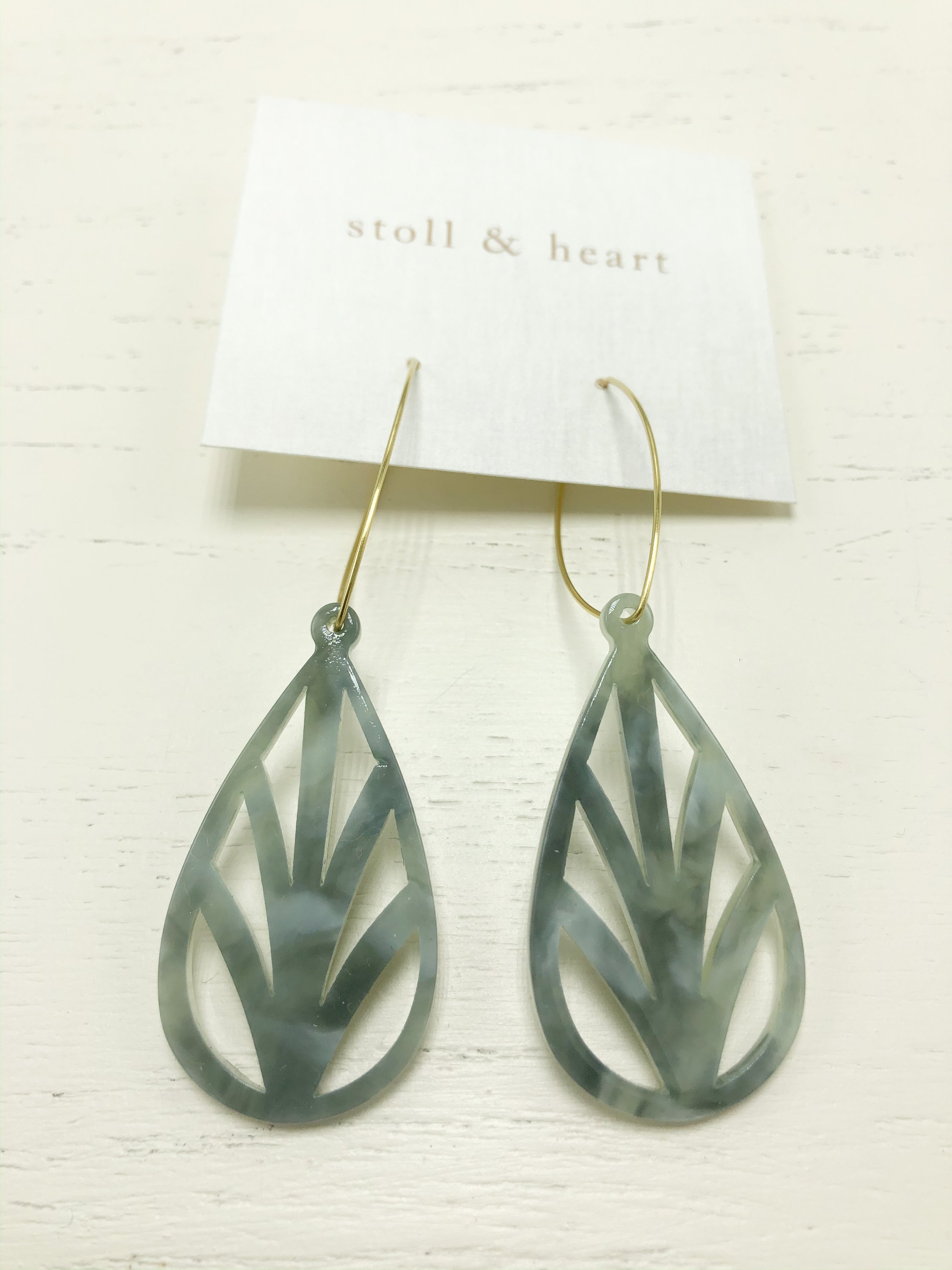 Monica Green/Grey earrings featuring brass hoops and tortoise shell resin detail in green and grey.