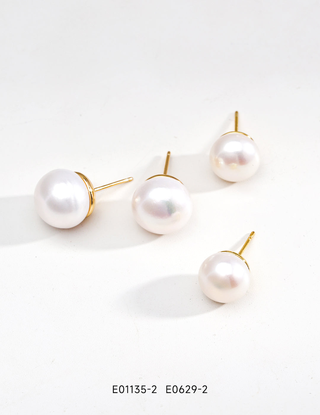 Elegant Pure Silver Pearl Stud Earrings featuring natural pearls and 925 silver setting in vintage gold and platinum finishes.