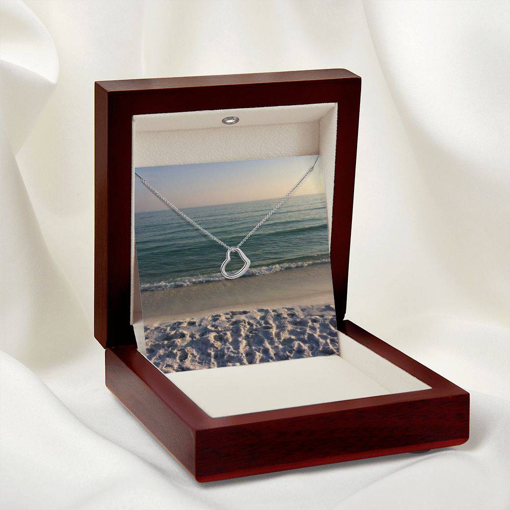 Delicate Heart Necklace in sterling silver with gold dip, elegantly displayed in a two-tone gift box.