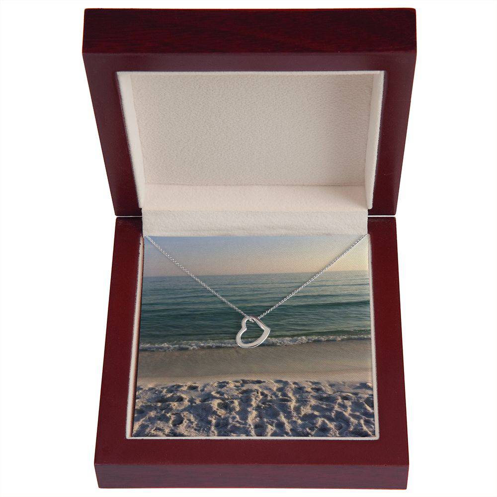 Delicate Heart Necklace in sterling silver with gold dip, elegantly displayed in a two-tone gift box.