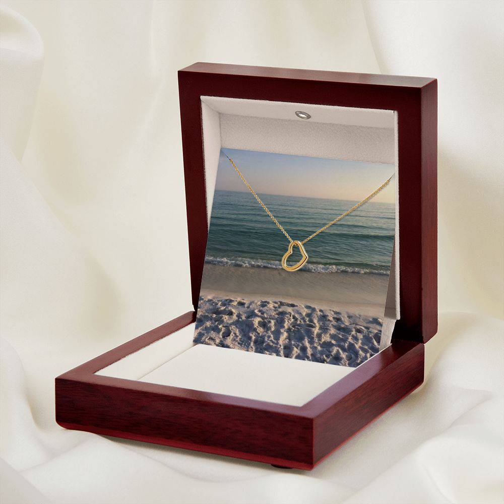 Delicate Heart Necklace in sterling silver with gold dip, elegantly displayed in a two-tone gift box.