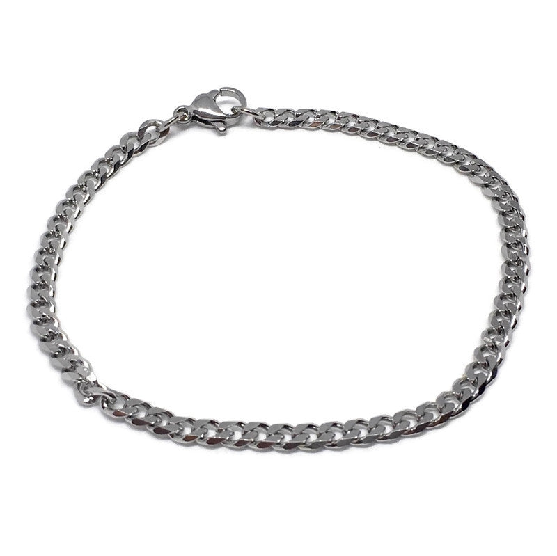 A stylish Thin Curb Chain Link Bracelet made of stainless steel, showcasing its sleek design and shiny finish.