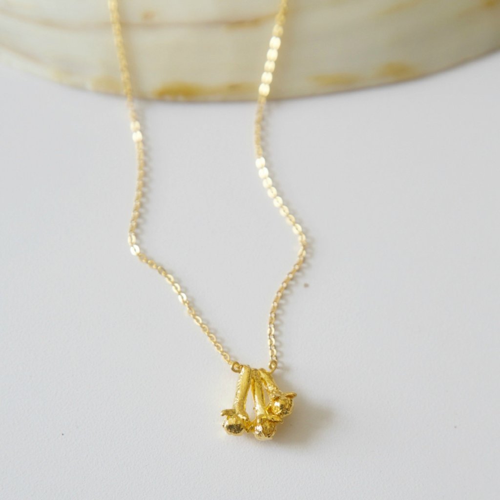 Three Clove Pendant featuring three gold-plated cloves on a delicate chain, showcasing intricate craftsmanship and traditional design.