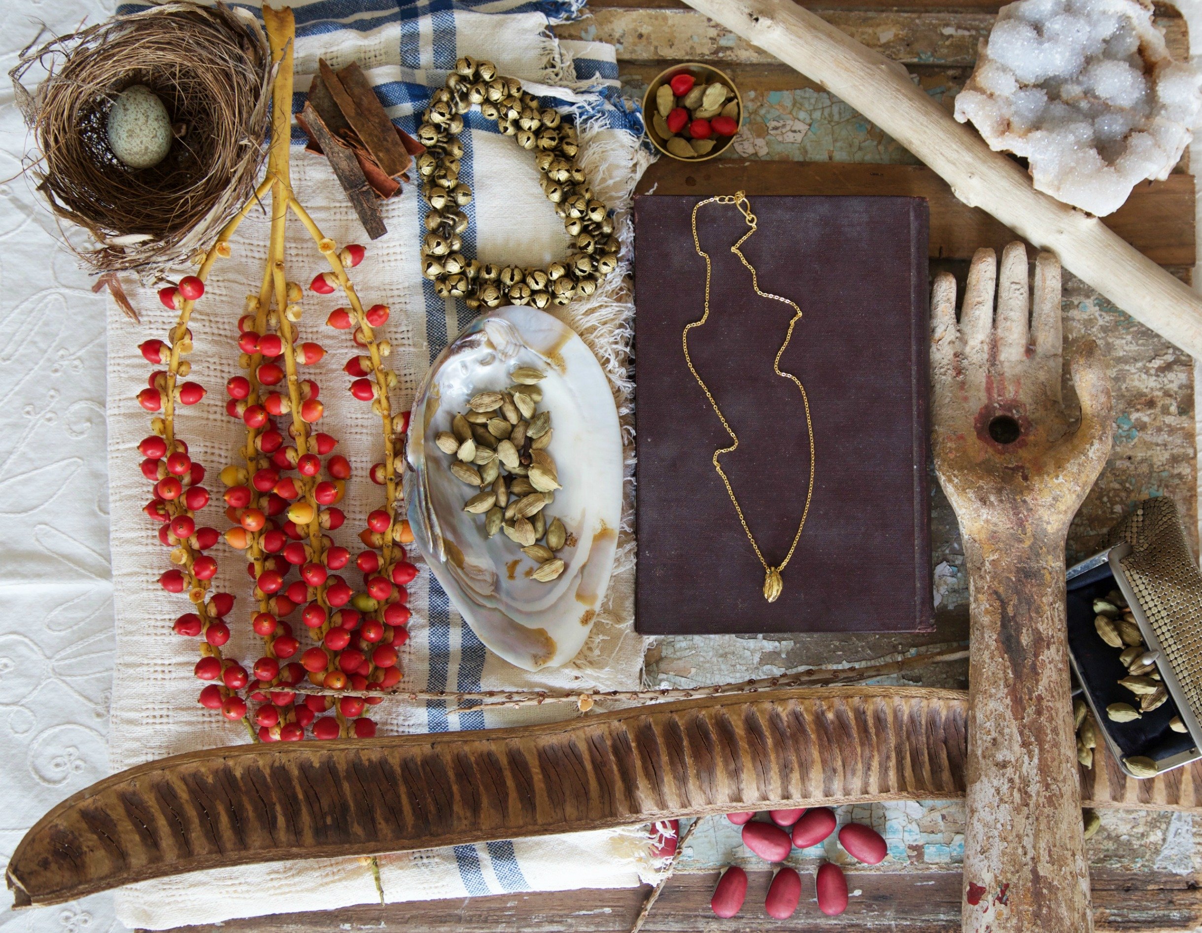 Three Clove Pendant featuring three gold-plated cloves on a delicate chain, showcasing intricate craftsmanship and traditional design.