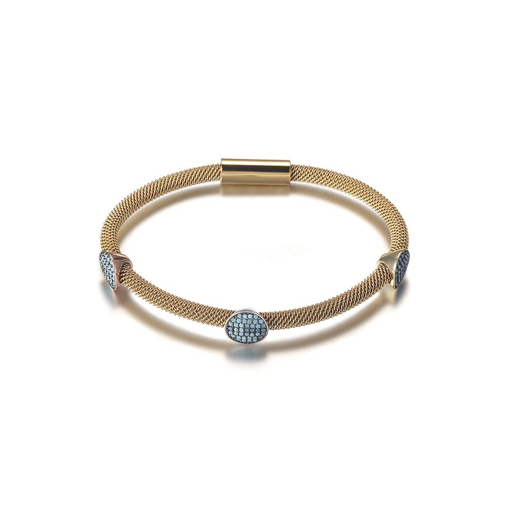 Three Stations Turquoise Cable Bangle featuring turquoise stones and gold accents on a stainless steel base.