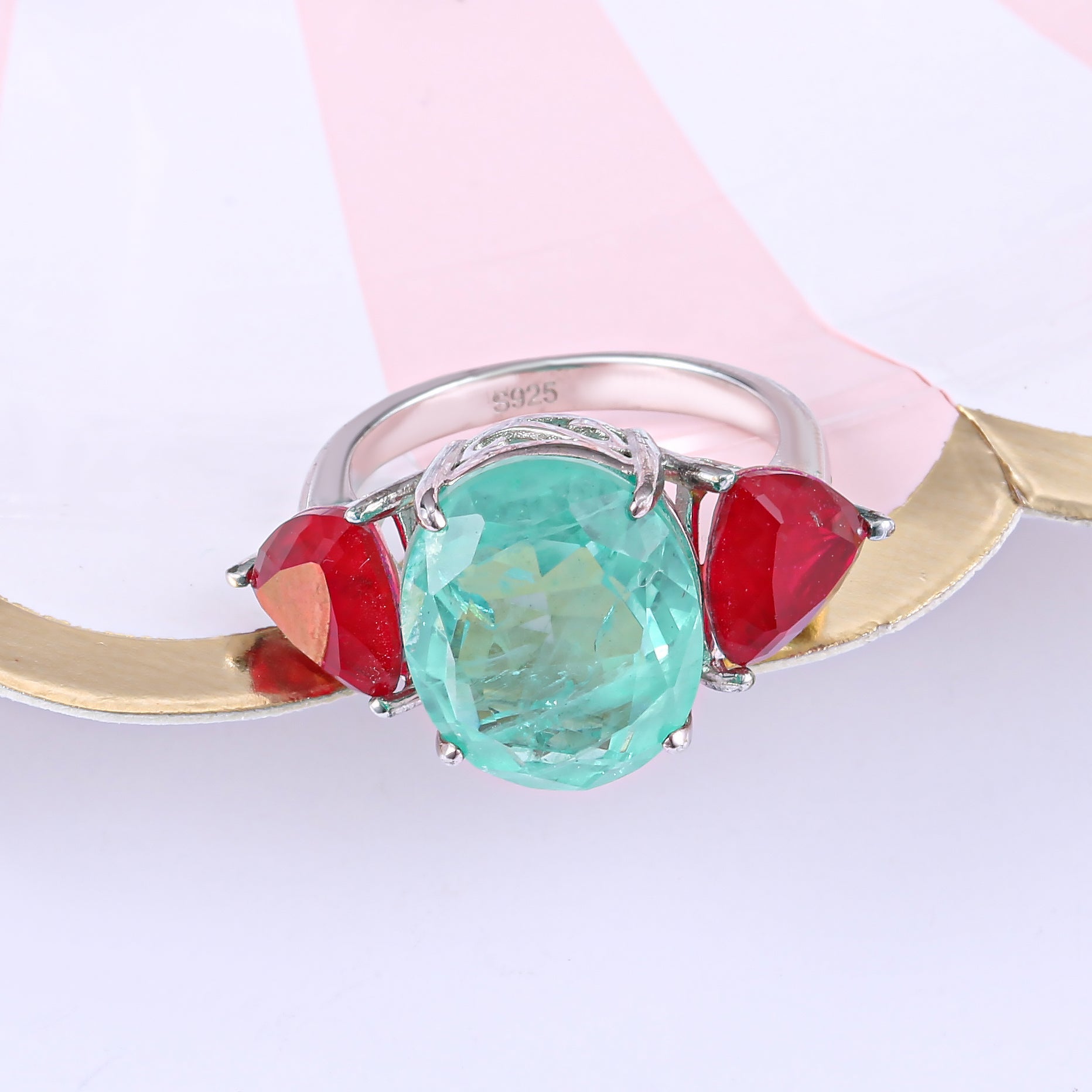 Three Stones Classic Eternity Ring in 925 sterling silver with paraiba ruby stones, showcasing a luxurious design.