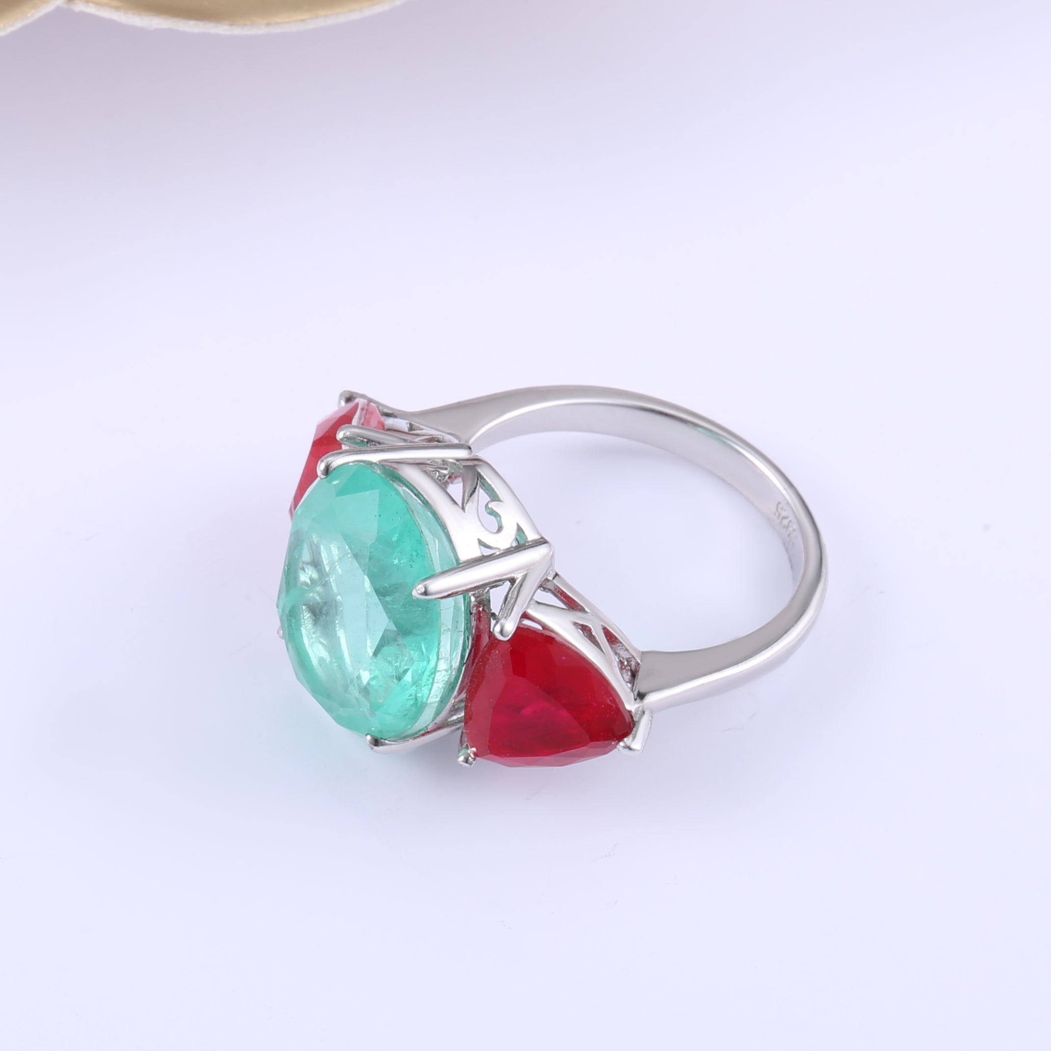 Three Stones Classic Eternity Ring in 925 sterling silver with paraiba ruby stones, showcasing a luxurious design.