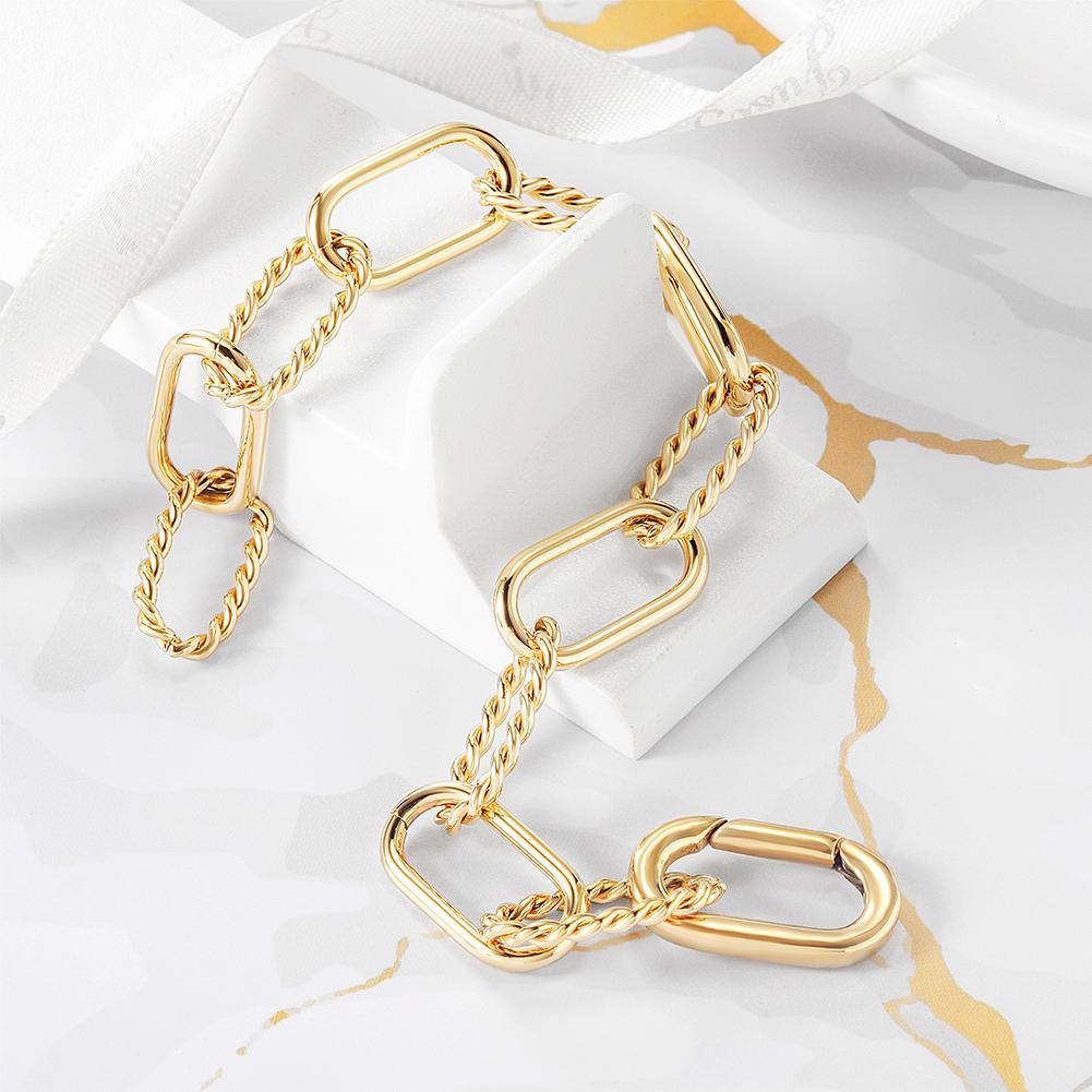 Elegant Threader Interlocking Bracelet made of surgical stainless steel with 14K gold PVD plating, showcasing its unique interlocking design.