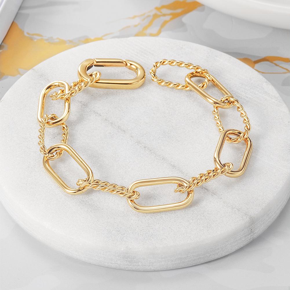 Elegant Threader Interlocking Bracelet made of surgical stainless steel with 14K gold PVD plating, showcasing its unique interlocking design.