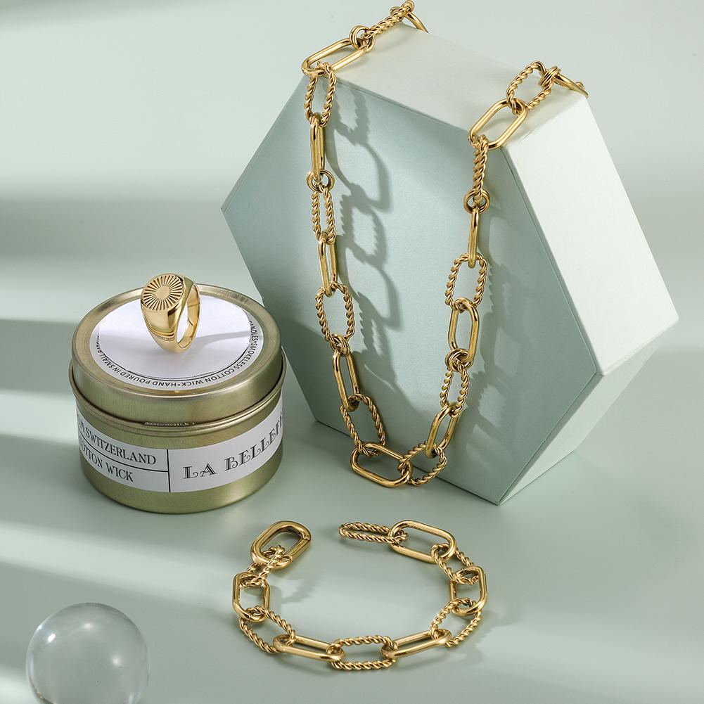 THREADER INTERLOCKING LINK SET featuring a geometric necklace, bracelet, and ring in a delicate gift box.