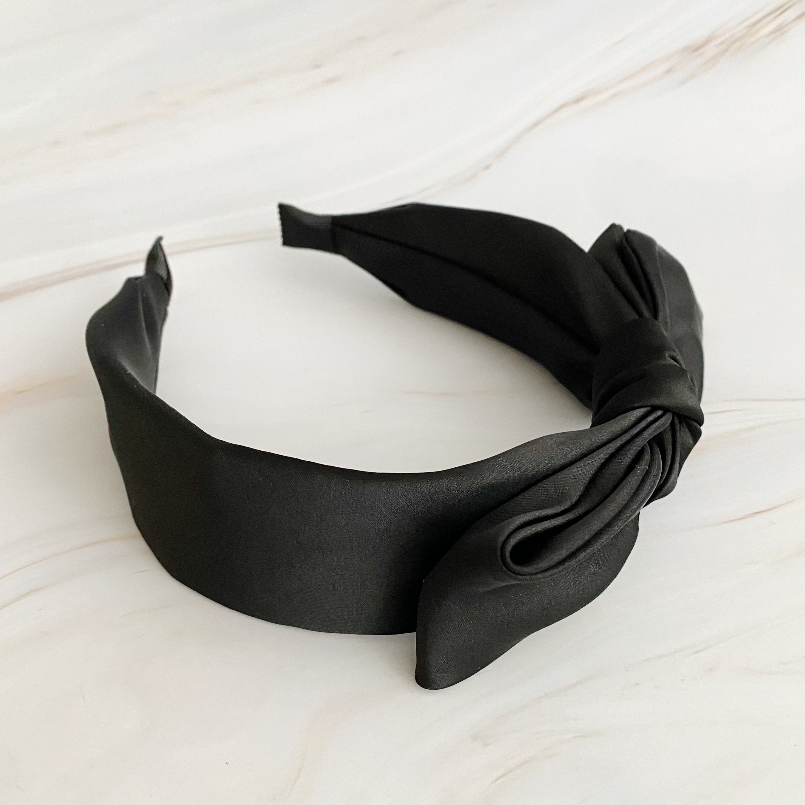 Elegant Tied Satin Side Bow Headband in luxurious satin fabric with a chic side bow design.