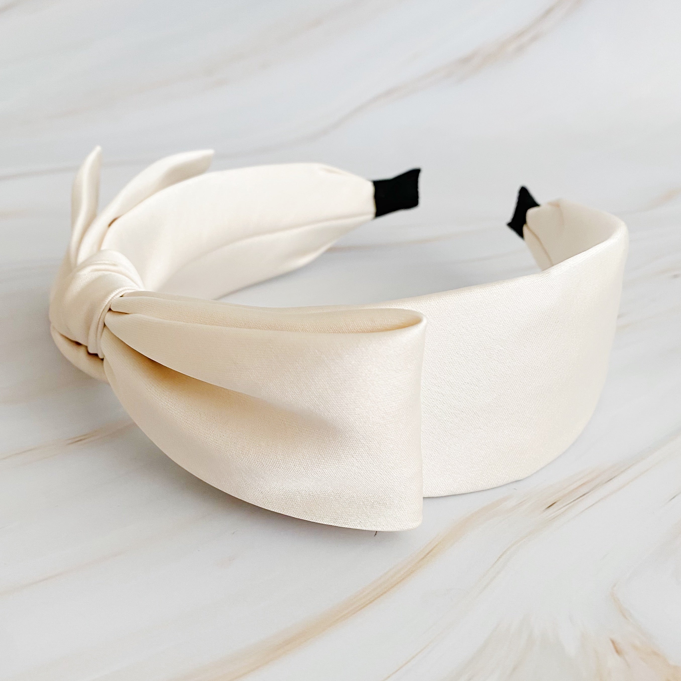 Elegant Tied Satin Side Bow Headband in luxurious satin fabric with a chic side bow design.