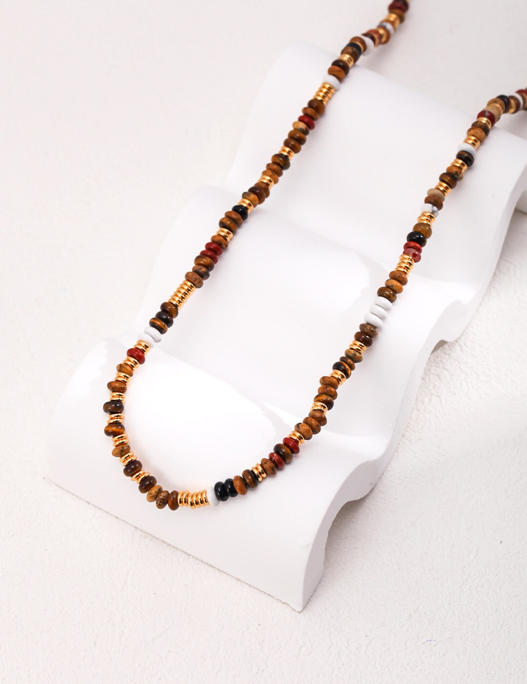 A beautiful handmade Tiger Eye Gemstone Beads Necklace featuring various gemstones and 18ct gold vermeil accents, elegantly displayed.