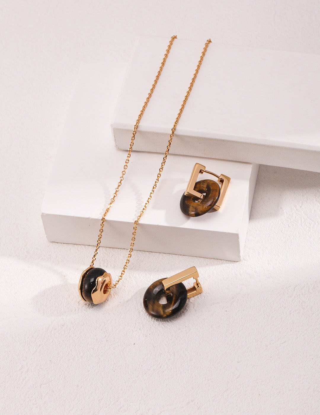 A beautiful handmade Tiger Eye Stone Necklace featuring a heart pendant, gold vermeil accents, and a delicate chain.