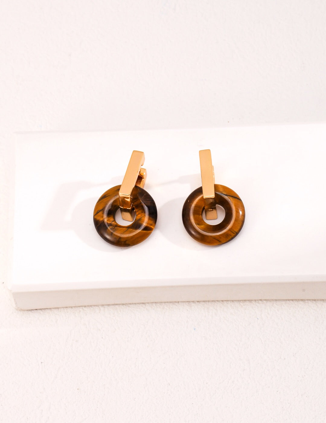 Handmade Tiger Eye Stone Pendant Earrings featuring sterling silver and gold vermeil, showcasing unique patterns and a luxurious finish.