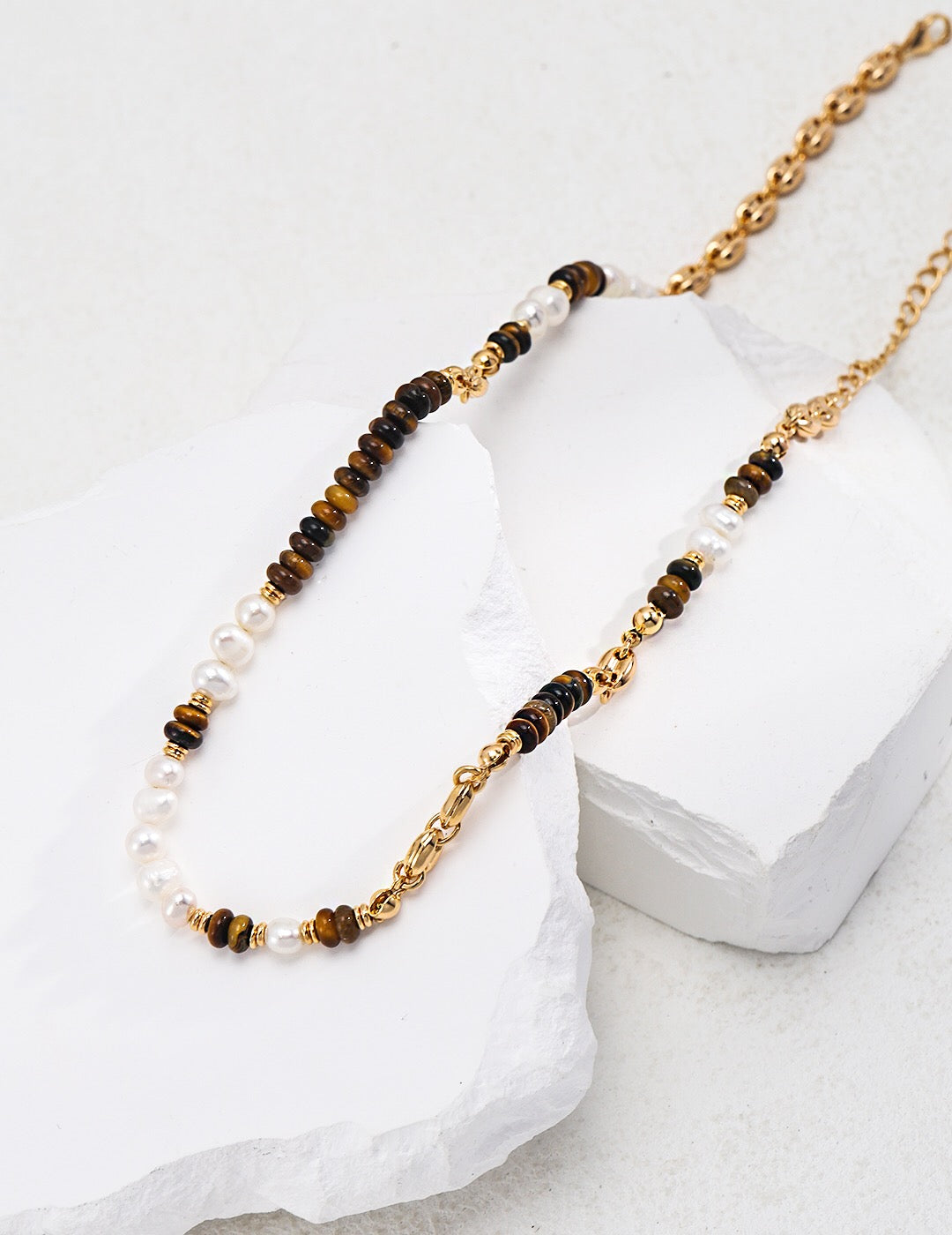 A beautiful Tiger Eye With Pearl Beaded Necklace featuring natural stones and gold vermeil accents, elegantly displayed on a soft background.