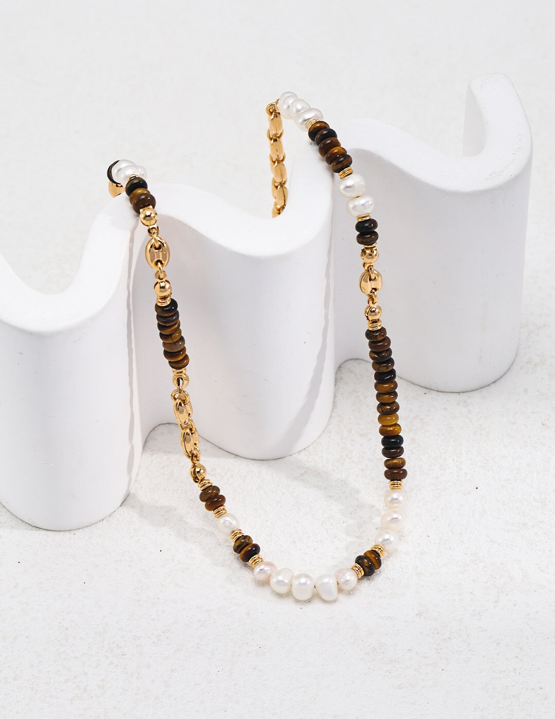 A beautiful Tiger Eye With Pearl Beaded Necklace featuring natural stones and gold vermeil accents, elegantly displayed on a soft background.