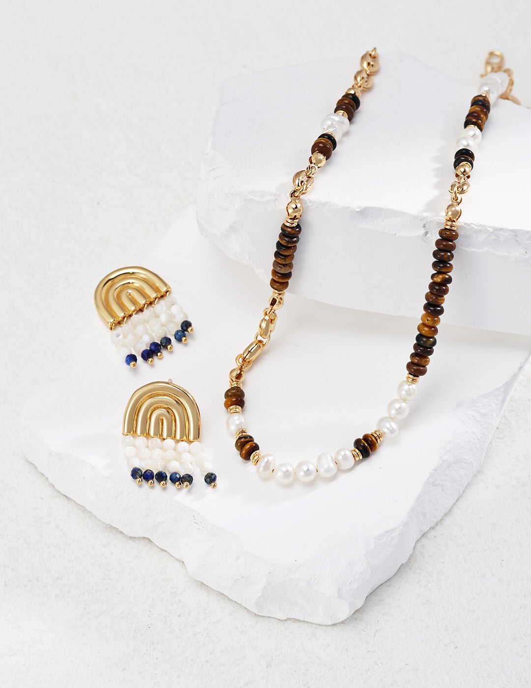 A beautiful Tiger Eye With Pearl Beaded Necklace featuring natural stones and gold vermeil accents, elegantly displayed on a soft background.