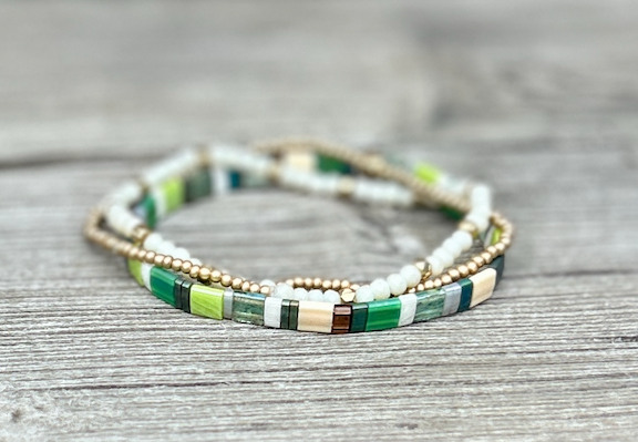 Tila Set Grassy Meadow bracelet featuring vibrant green Miyuki Tila beads and white stretchy design, perfect for bohemian style.