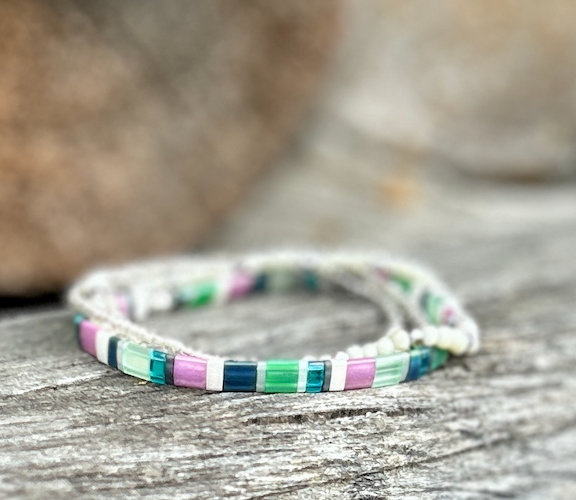 Colorful Tila Set Preppy Stretchy Tila Bead Bracelet featuring greens, pinks, white, and silver beads, showcasing a bohemian style.