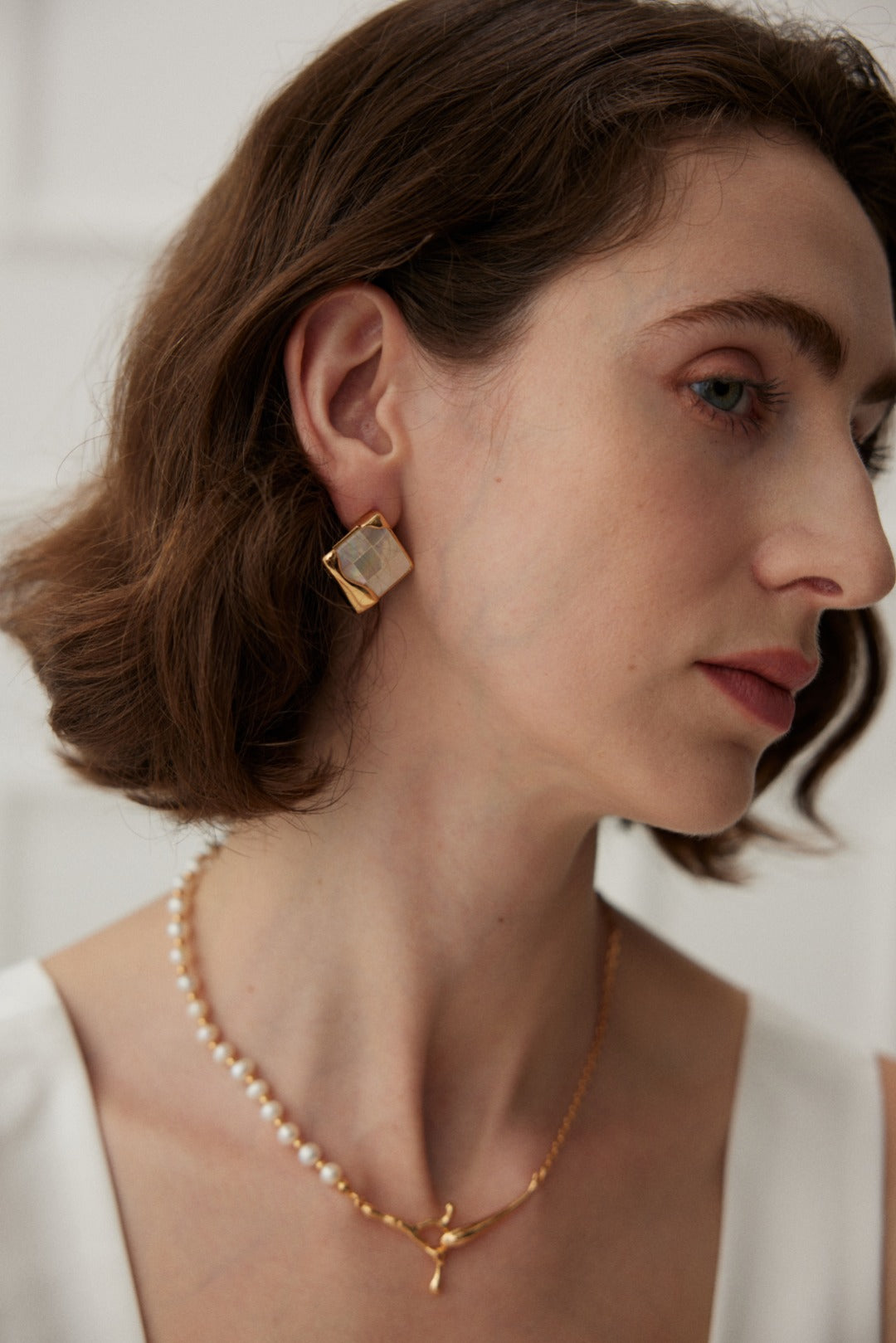 Timeless Mosaic Pure Silver Shell Earrings featuring intricate shell inlays and vintage gold finish, elegantly designed for modern and classic styles.