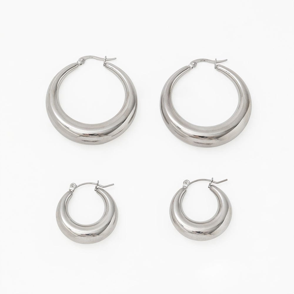 Timothy Gold Hoops earrings in small and large sizes, showcasing a thick chunky design with a polished finish.