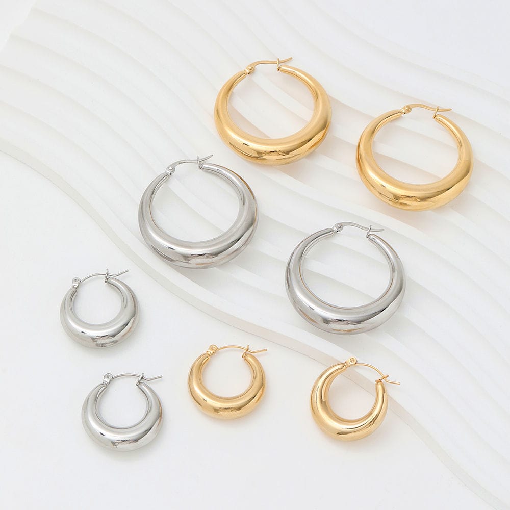 Timothy Gold Hoops earrings in small and large sizes, showcasing a thick chunky design with a polished finish.