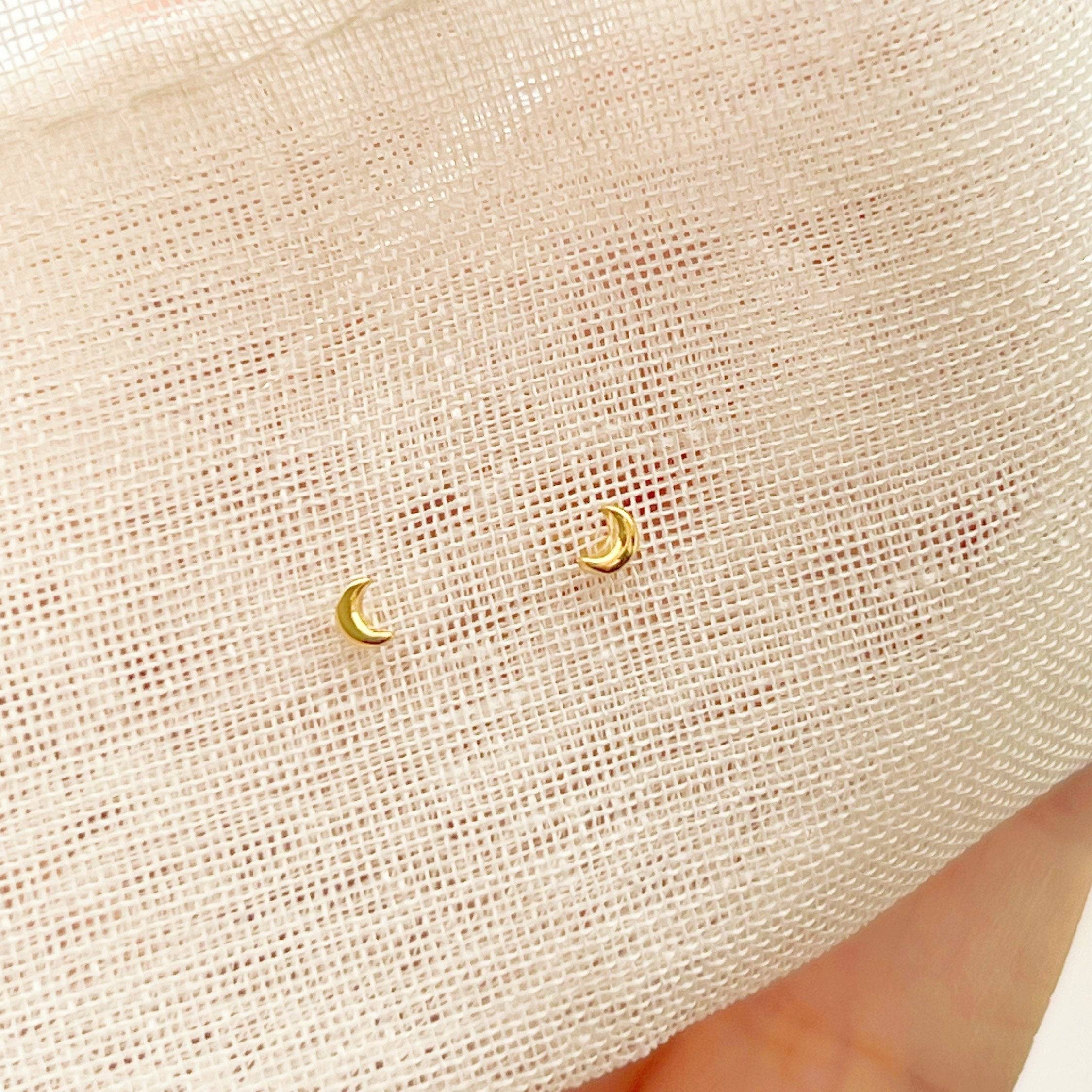 Tiny and Mini New Moon Earrings in sterling silver, showcasing a delicate moon design.