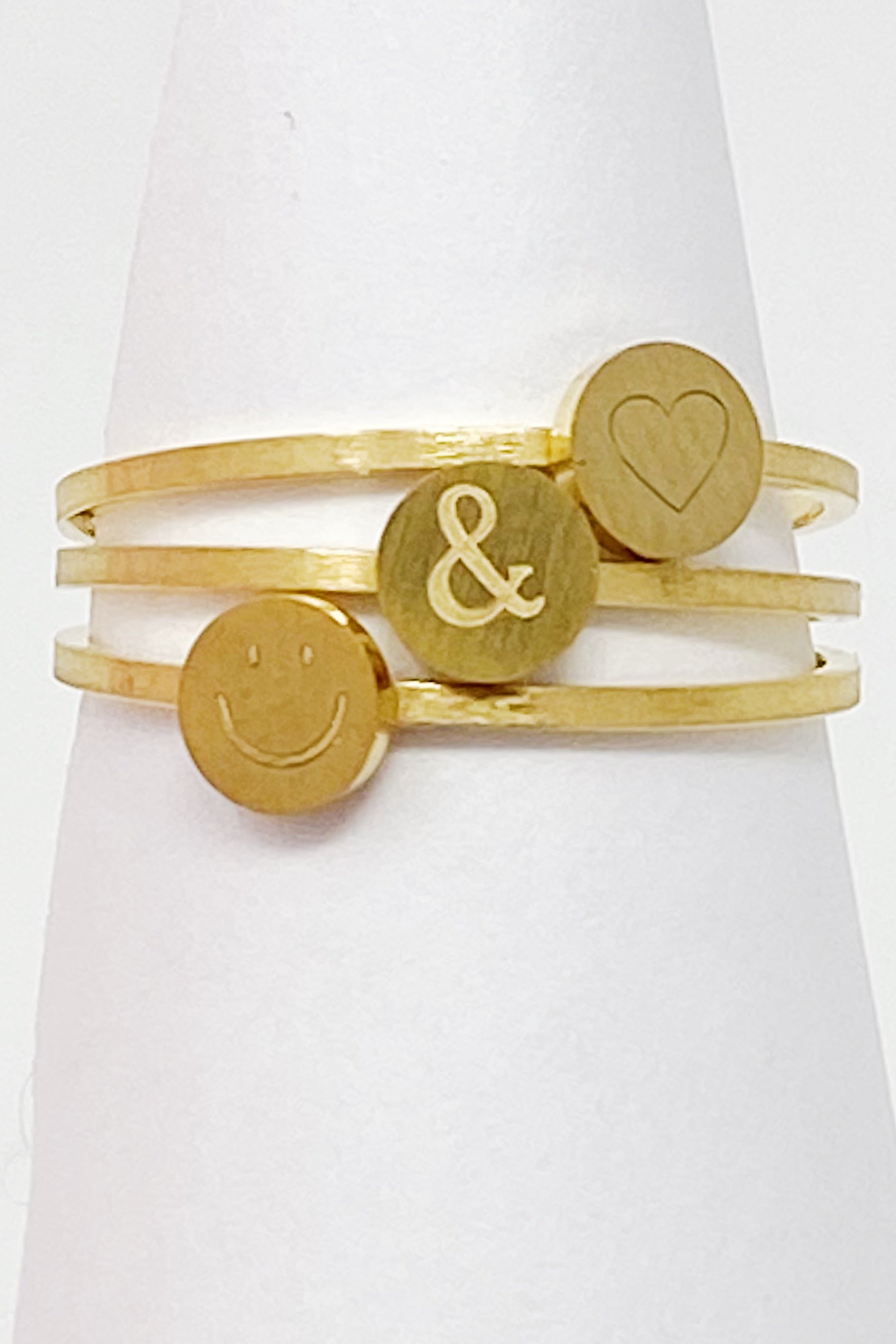 Tiny Disc Stackable Ring featuring monogrammed symbols, 18K gold plated stainless steel, size 7.