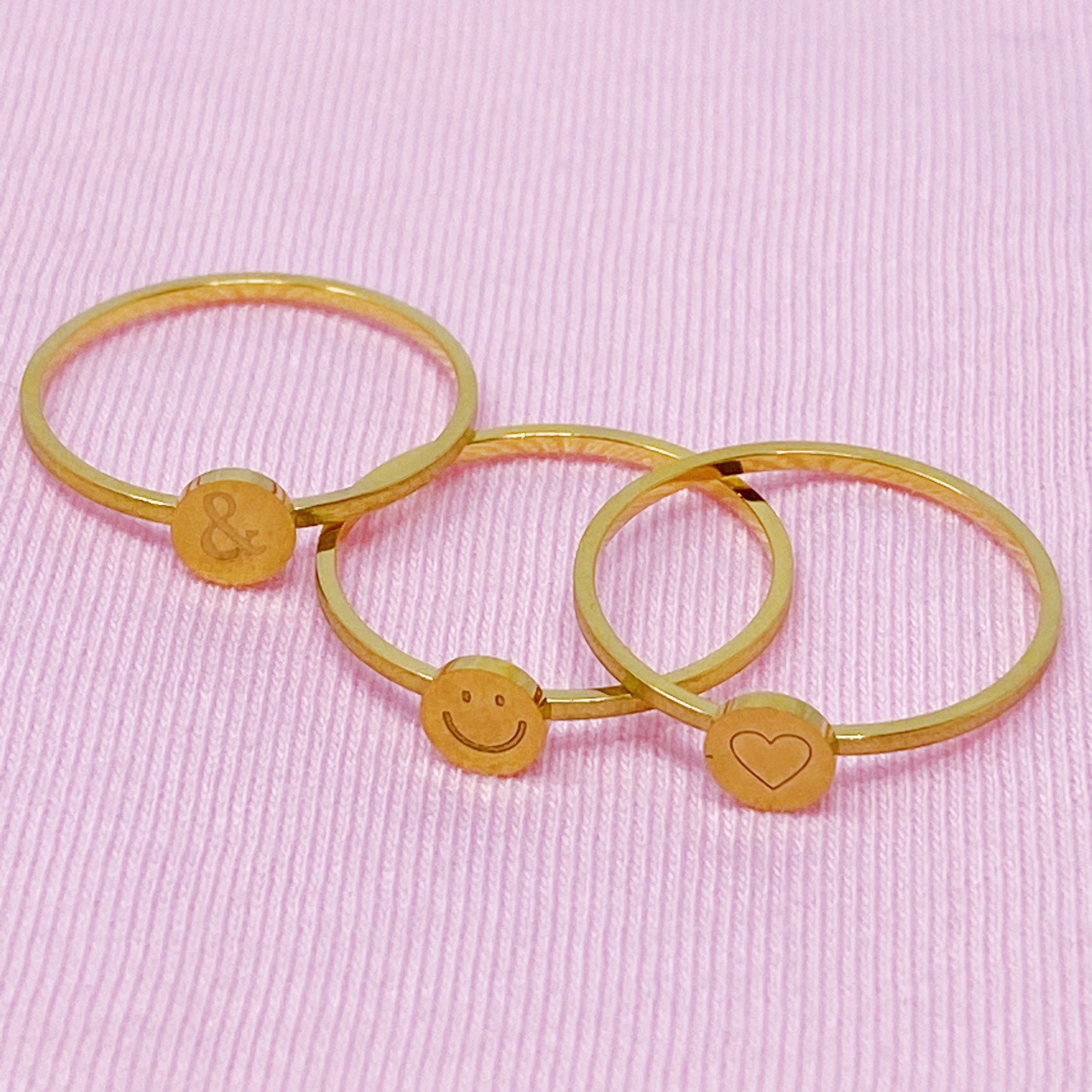 Tiny Disc Stackable Ring featuring monogrammed symbols, 18K gold plated stainless steel, size 7.