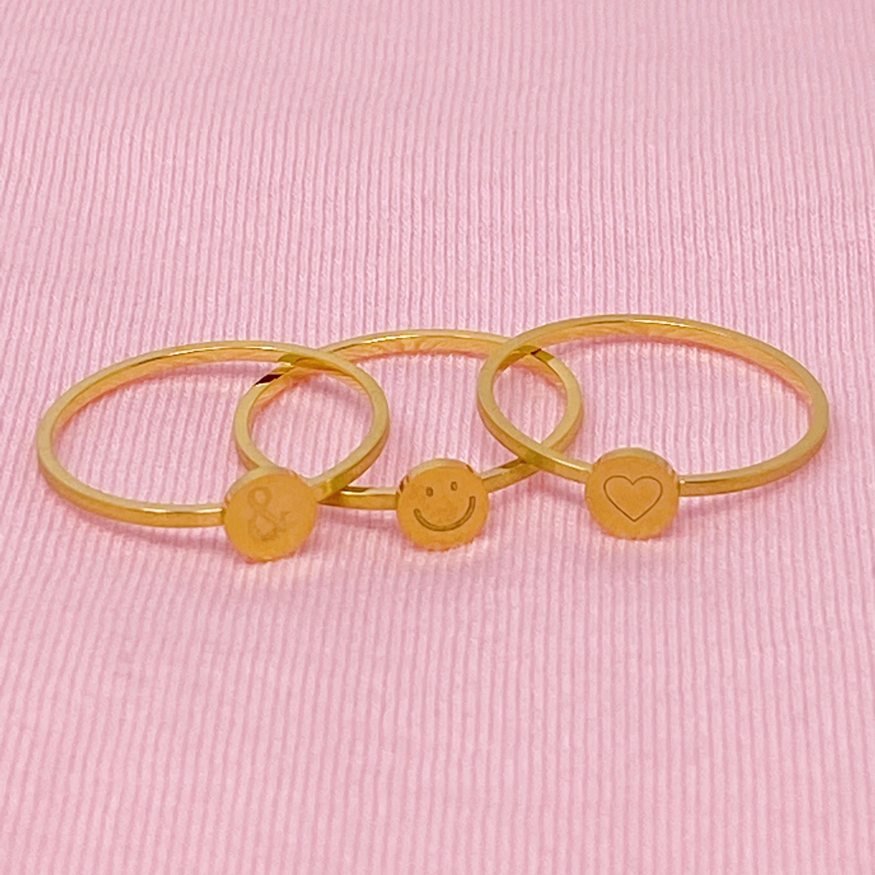 Tiny Disc Stackable Ring featuring monogrammed symbols, 18K gold plated stainless steel, size 7.