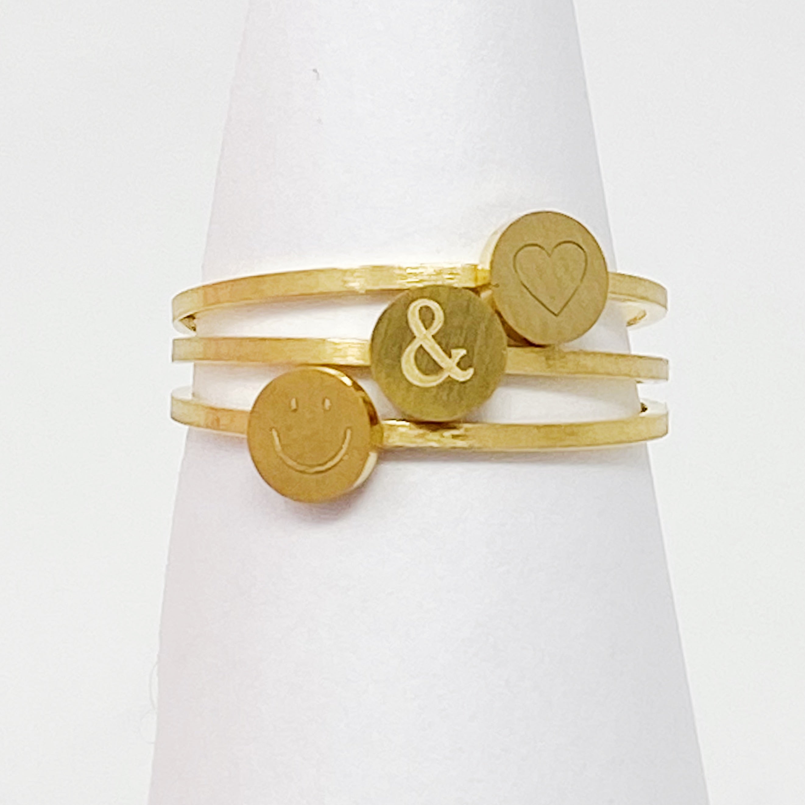 Tiny Disc Stackable Ring featuring monogrammed symbols, 18K gold plated stainless steel, size 7.