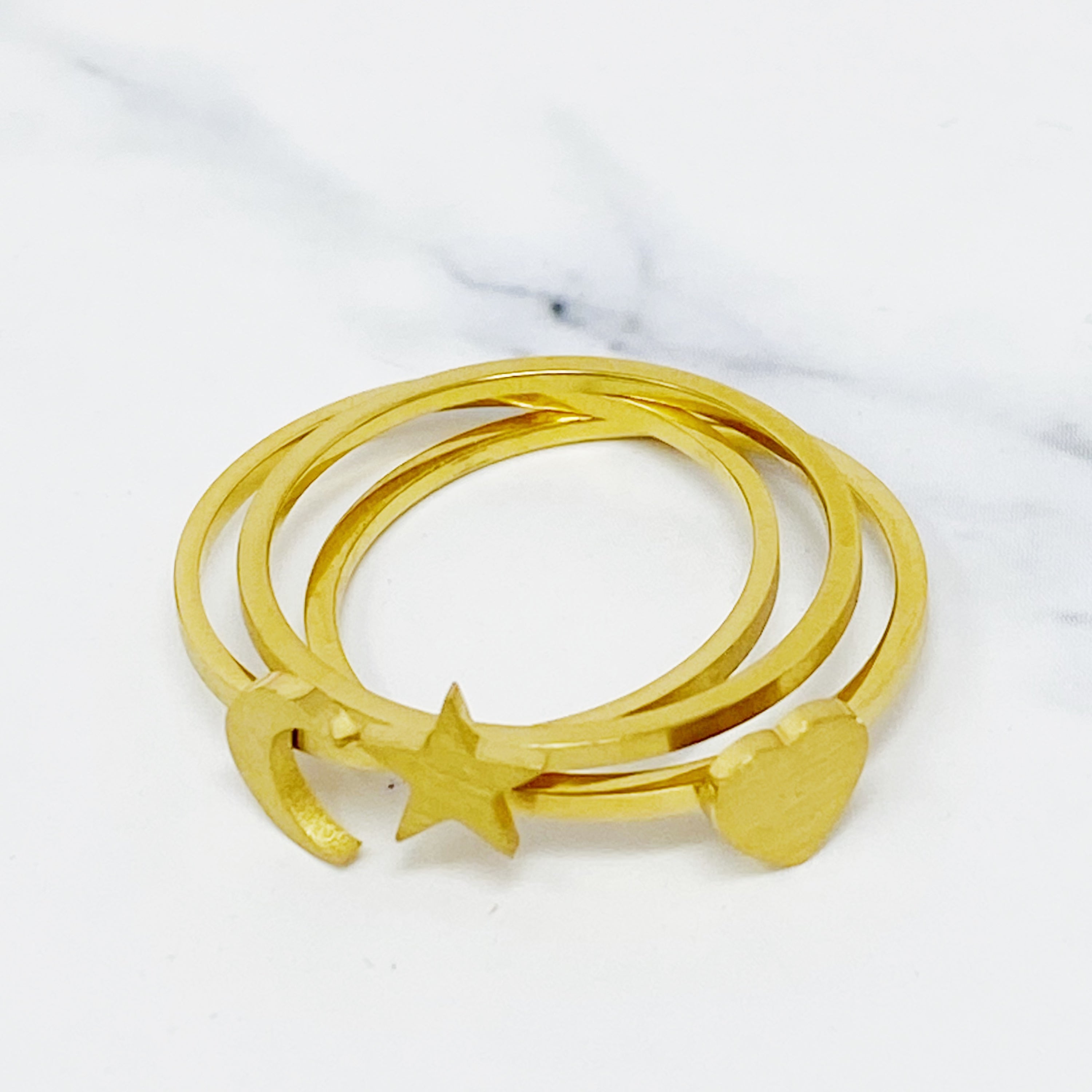 Tiny Figure Stackable Ring featuring various shapes, 18K gold plated stainless steel, size 7, perfect for stacking.