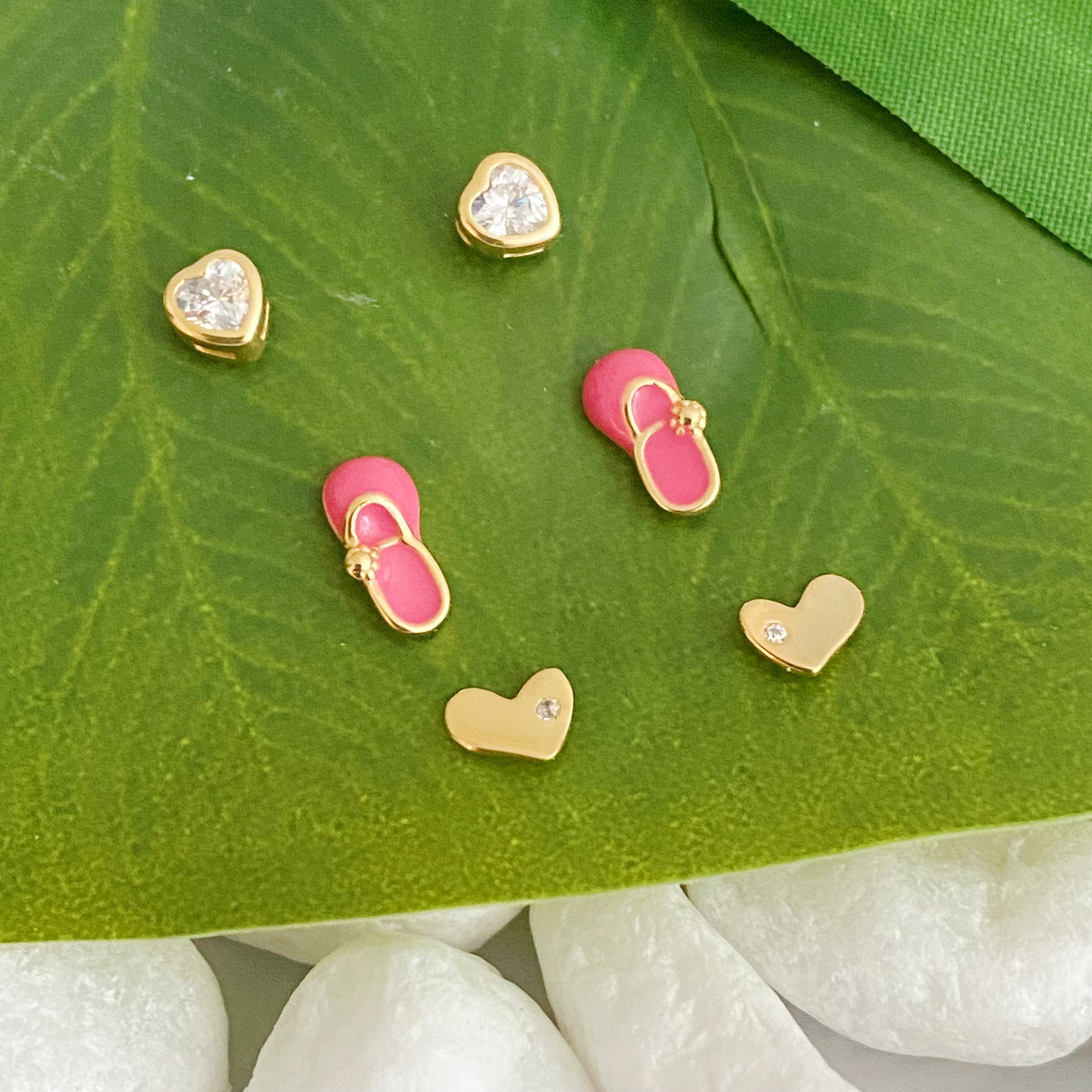 Tiny Shape Tiny Stud Sterling Silver Earrings featuring heart and flip flop designs, elegantly displayed on a logo card.