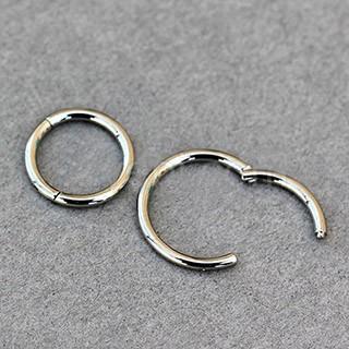 A sleek Titanium Seamless Clicker Ring showcasing its seamless circular design and click closure mechanism, ideal for body piercings.