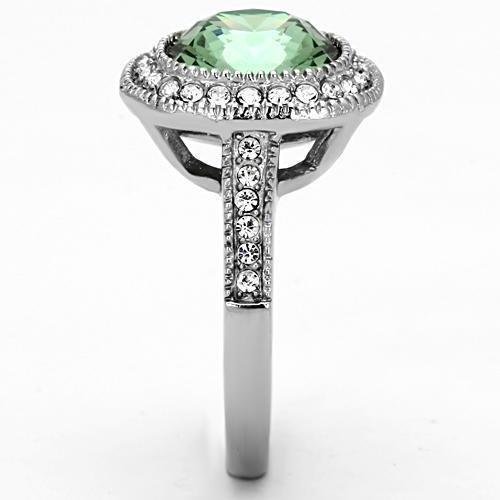 High polished stainless steel ring featuring an emerald crystal centerpiece, showcasing a sleek and modern design.