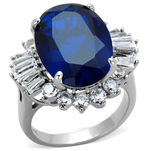 High polished stainless steel ring featuring a London Blue Spinel center stone, showcasing a sleek and elegant design.