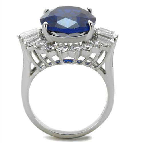 High polished stainless steel ring featuring a London Blue Spinel center stone, showcasing a sleek and elegant design.