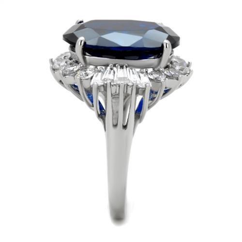 High polished stainless steel ring featuring a London Blue Spinel center stone, showcasing a sleek and elegant design.