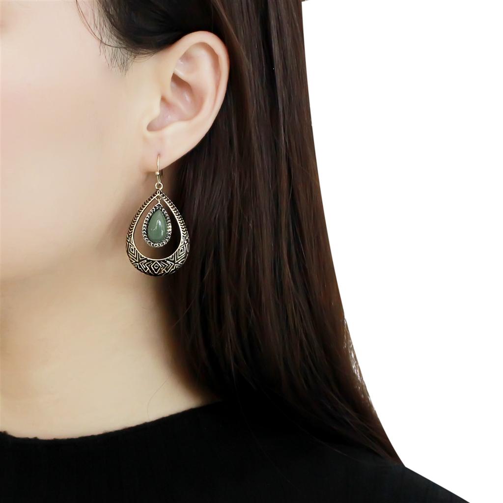 TK2576 IP Gold Stainless Steel Earrings featuring emerald jade stones, showcasing elegance and durability.