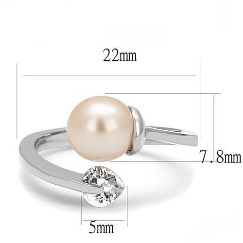 High polished stainless steel ring featuring a light peach synthetic pearl, showcasing its elegant design and shine.