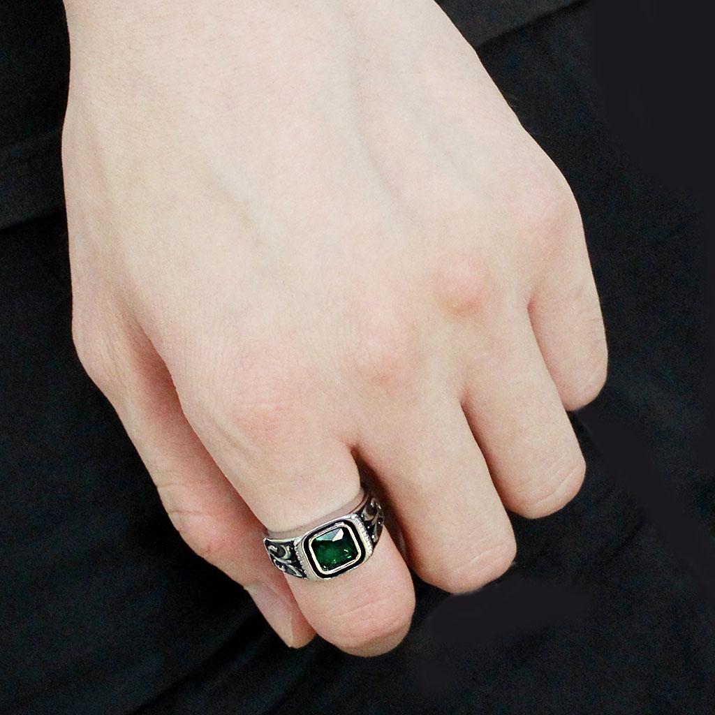 TK3616 High Polished Stainless Steel Ring featuring a synthetic emerald stone, showcasing a sleek and modern design.