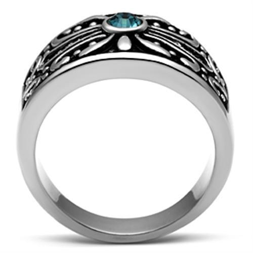 Ornate ring with blue gemstone.