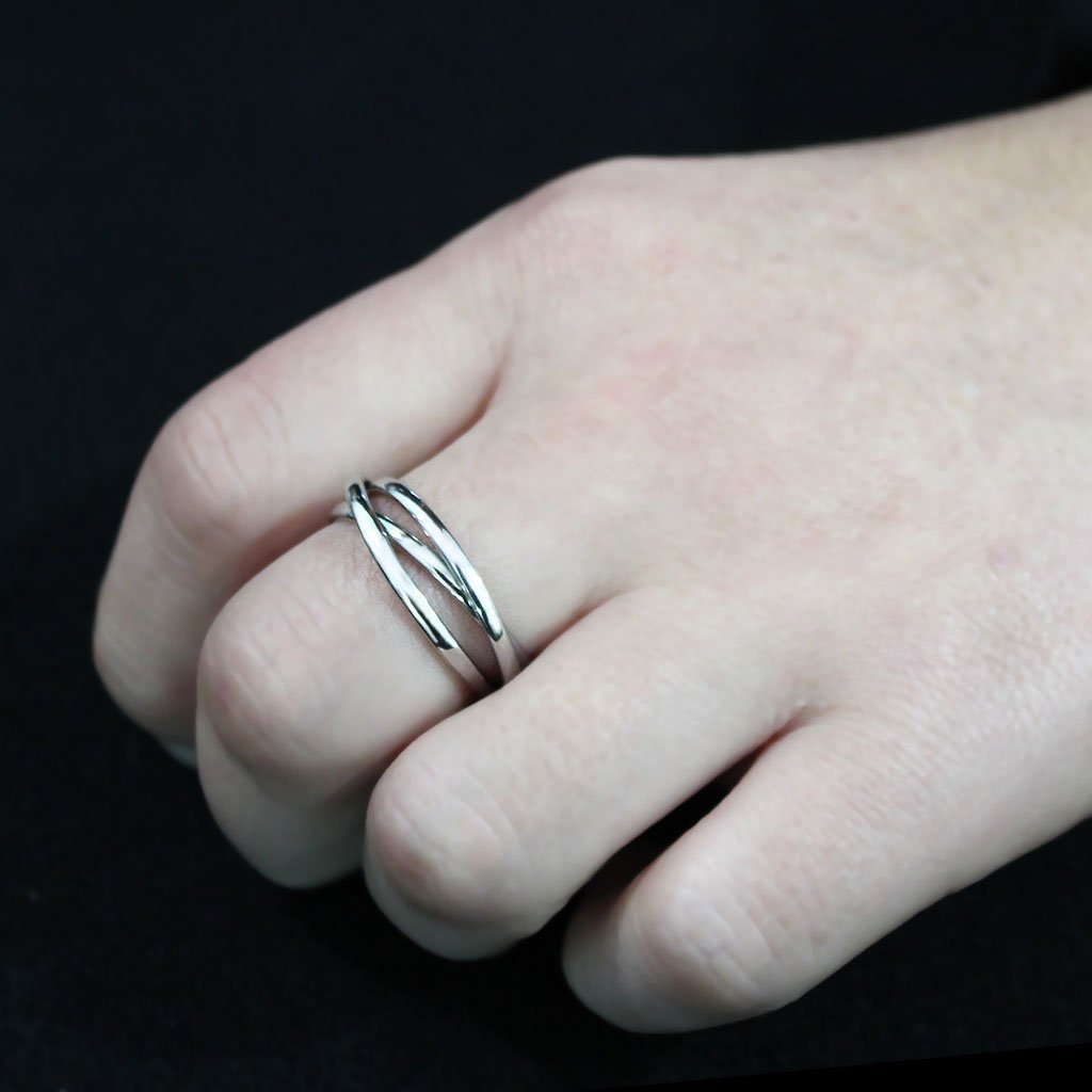 High polished stainless steel interlocking ring with a sleek design, perfect for any occasion.