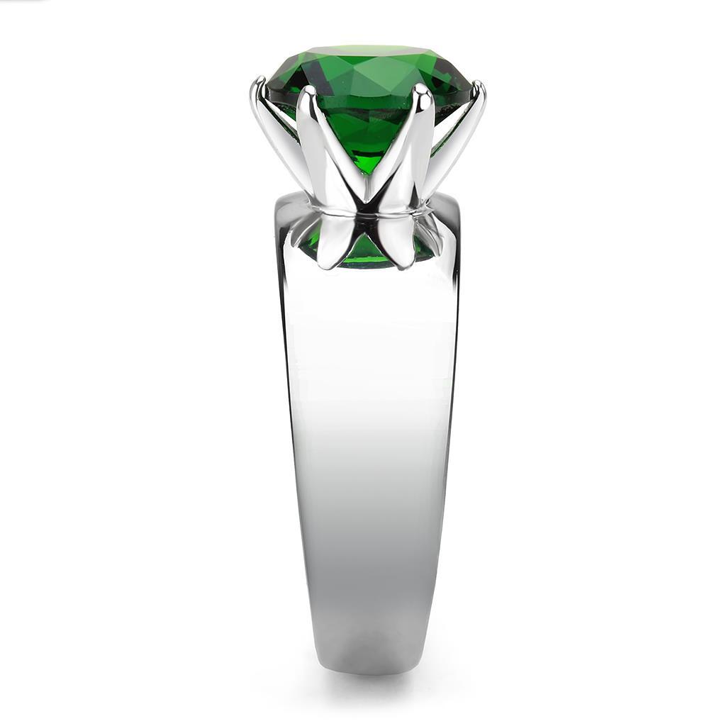 High polished stainless steel ring featuring a synthetic emerald glass stone, showcasing a sleek and elegant design.